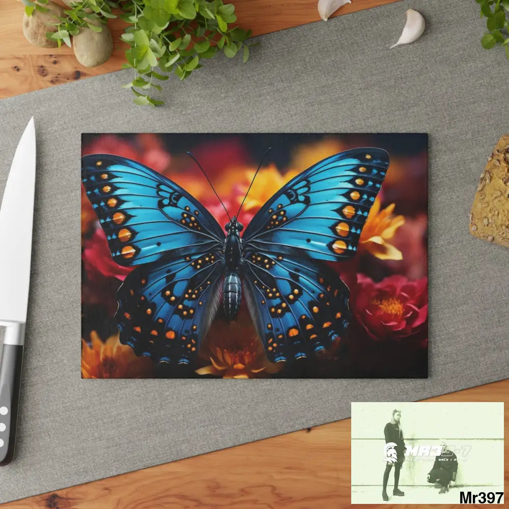 Blue Butterfly on flower with Black and Orange Spots Glass Cutting Board Home Decor