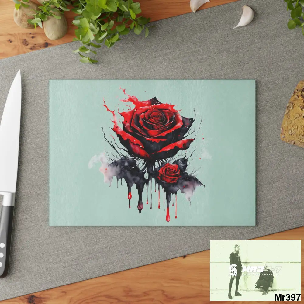 Red Rose with blood drippings on black abstract background Cutting Board Home Decor